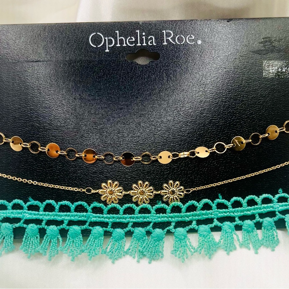 set from Ophelia Roe. features three distinct pieces choker necklaces